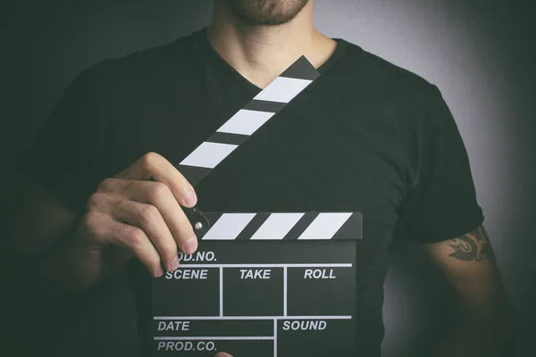 Movie clapper and young man — Stock Photo, Image