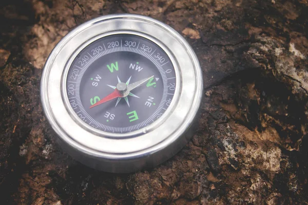 Compass lying on the ground — Stock Photo, Image