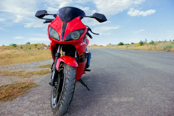 Red sport bike stands on the track — 스톡 사진