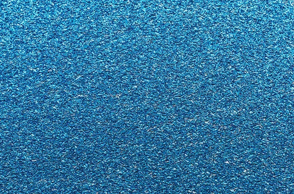 Blue glitter texture. Christmas or new year background for design.