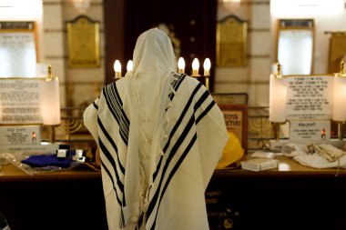 Jew praying in a synagogue clipart