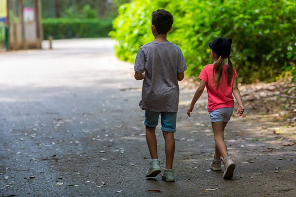 mom helps brother sister