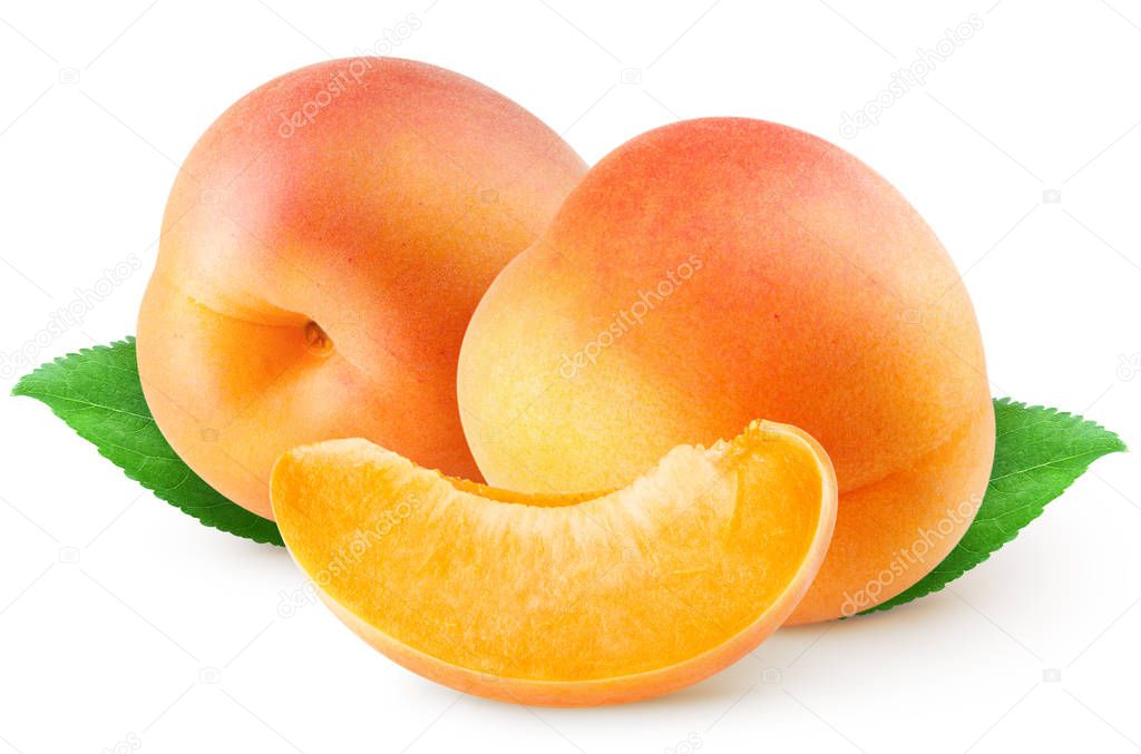 Isolated apricots. Two whole apricot fruit and piece with leaves isolated on white background with clipping path