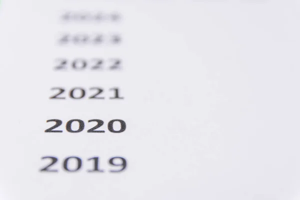 List of recent years on white paper. Focus on 2020. Copy Space — Stock Photo, Image