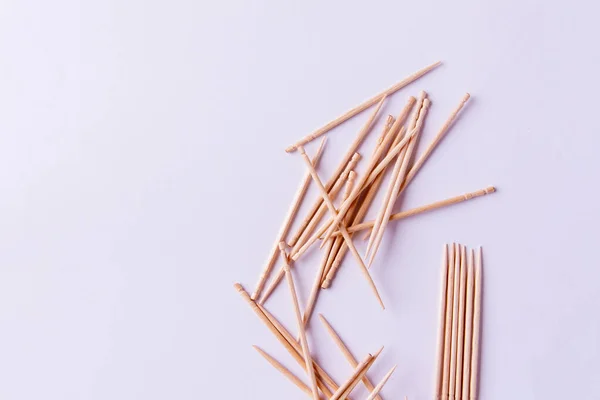 Toothpicks on a white background. Free space for text — Stock Photo, Image