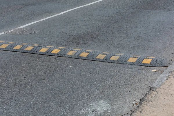 Traffic safety. Artificial roughness on the road. Stock photo.
