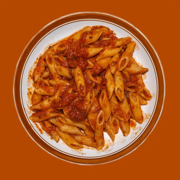Pasta in red sauce on a table
