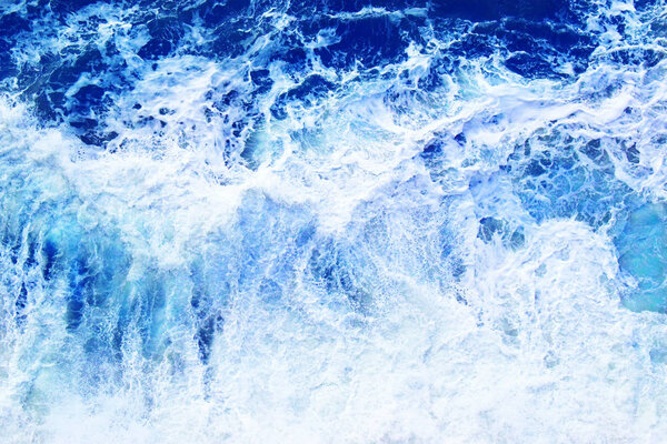 Defocused top view of storm sea