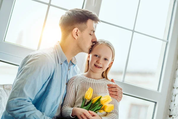 He's such a proud father. Young father with his adorable daughter. — Stock Photo, Image