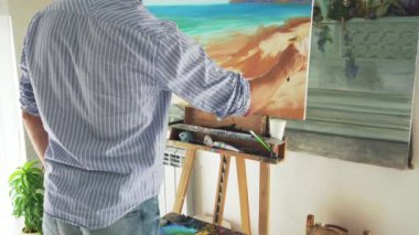 Erkek ressam boyalar manzara tuval üzerine