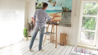 Erkek ressam boyalar manzara tuval üzerine