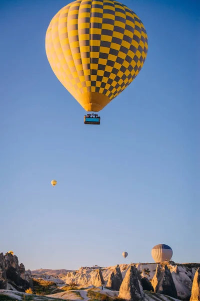 big balloon flies over mountains