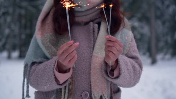 Woman holding burning sparklers, slow motion — Stock Video