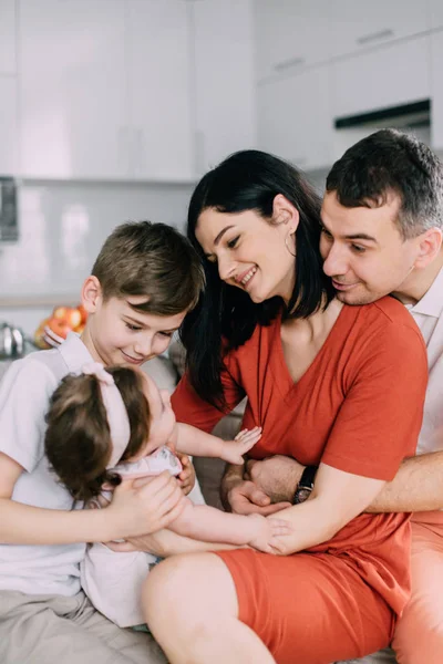 Happy family sitting on couch at home