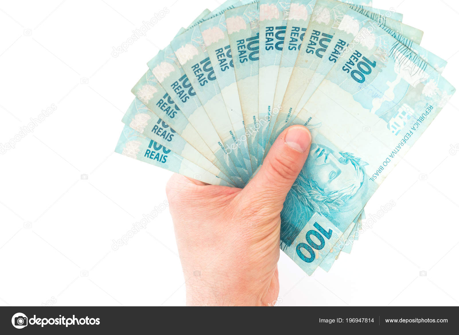 巴西货币雷亚尔高面额持有在你的手掌—— 库存社论照片© rochu_2008 #196947814