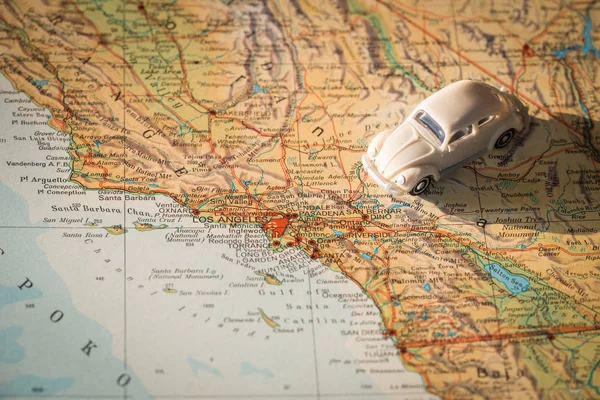Miniature car on the United States map, concept of holiday trip