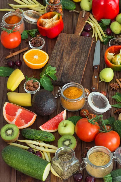Healthy food, clean food selection:  fruits, vegetables, seeds, spices on wooden background