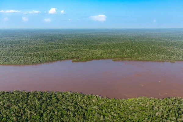 Top view of the Iguazu waterfalls, parana river and huge rainforest spaces