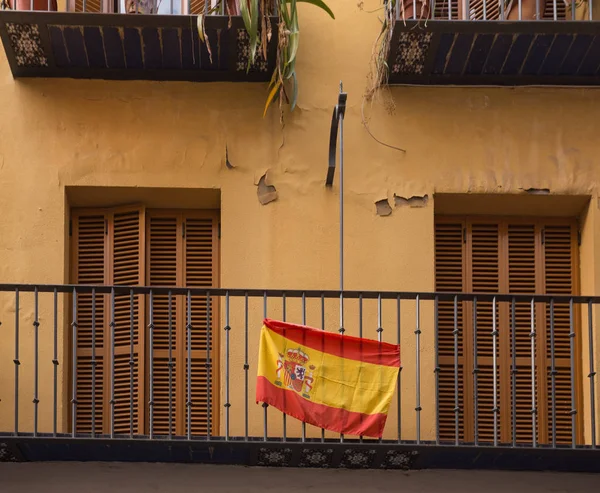 Spain flag hung on the balcony of the tenement house