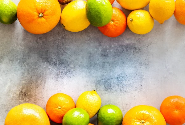 citrus fruits on a stone counter top