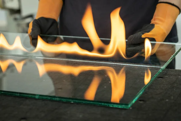 Cutting safety glass, VSG (Very Safe Glass) The fire burns through the foil connecting the panes, A specialized technique of cutting laminated glass