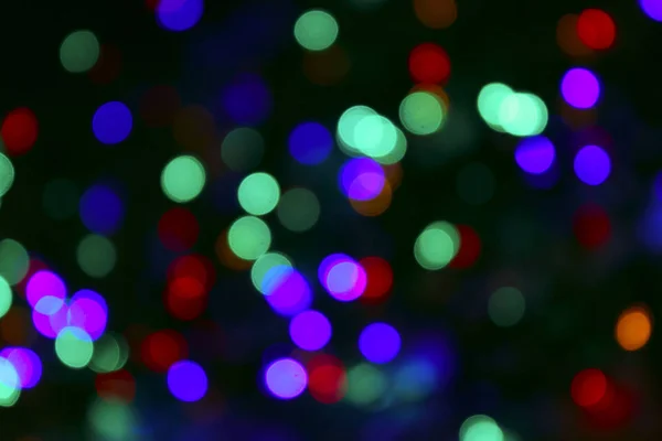 Abstract Multicolors Background. Colorful Abstract Background. Colorful Texture. Blurred Image Of Colorful Lights. Blurred Christmas Lights On Dark Background. Blurred Image.