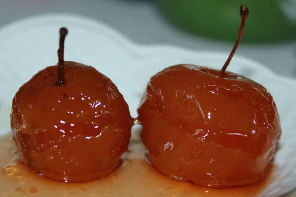 Two Sweet Apples, Jam.  Homemade Caramel Apples. Two Caramelized Apples  On A Plate.