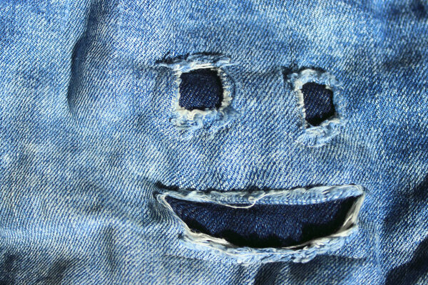 Ripped Jeans Texture Background. Abstract Blue Denim Background. Cropped Shot Of Blue Denim Jeans.