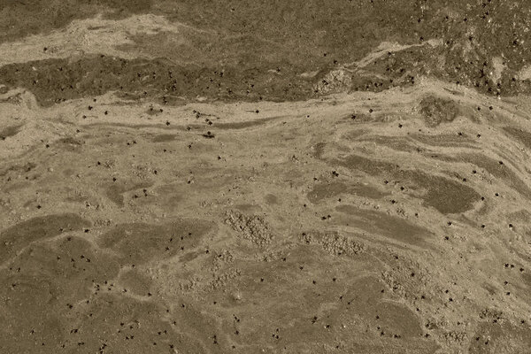 Cropped shot of dirty water, top view. Ecology, environmental pollution, nature concept. Abstract colorful background texture.