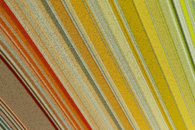 Soyut doku arka planının bulanık görüntüsü, sarı renkler. Sarı gölgeli palet, çizgili manzara.