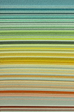 Soyut doku arka planının bulanık görüntüsü, sarı renkler. Sarı gölgeli palet, çizgili manzara.