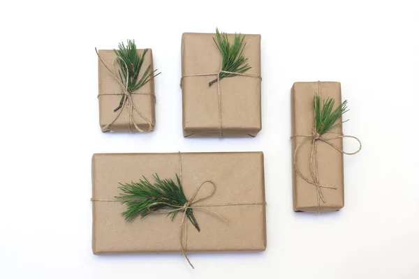 Eco style gift wrapping. Composition with gift boxes decorated with pine branches