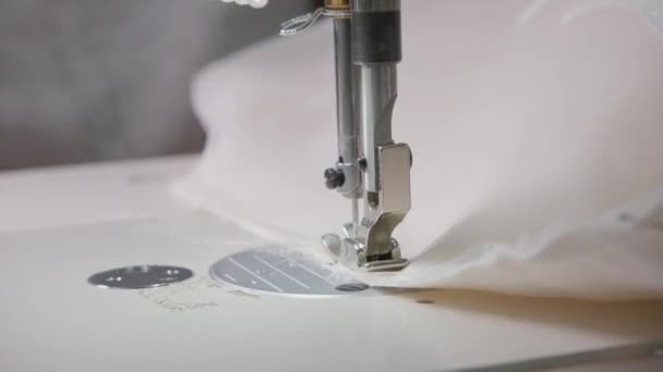 Close-up of sewing machine, stitch thread seam. Equipment for sewing elegant wedding dress. Hand made — Stock Video