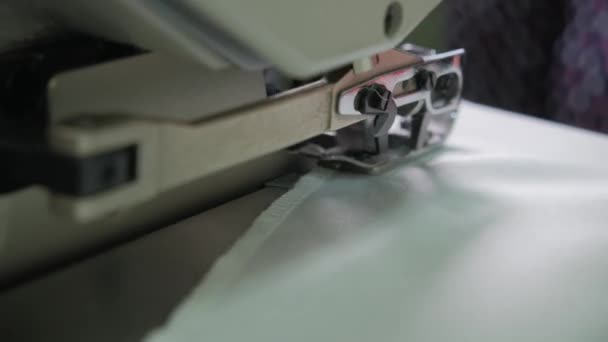 Close-up of sewing machine, stitch thread seam. Equipment for sewing elegant wedding dress. Hand made — Stock Video