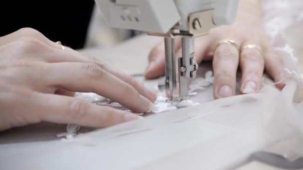 Close-up of sewing machine, stitch thread seam. Equipment for sewing elegant wedding dress. Hand made — Stock Video