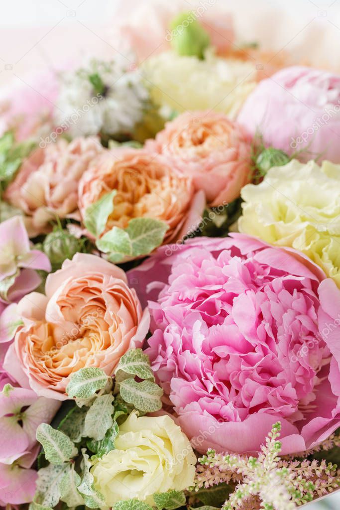 beautiful summer bouquet. flower arrangement with peonies. Color light pink. The concept of a flower shop.