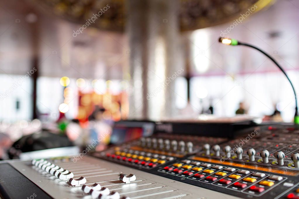 control Fader. Mixing console of light equipment operator at the concert. Sound recording studio mixing desk with engineer or music producer