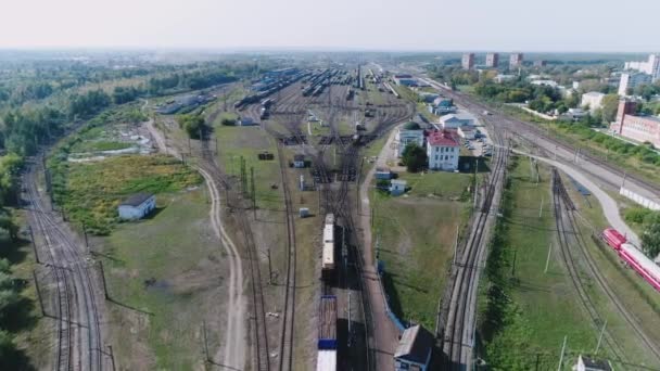 Logistics concept. many ways, freight trains re sorting. industrial railway landscape. Railroad tracks. Top view shooting with quadrocopter. — Stock Video