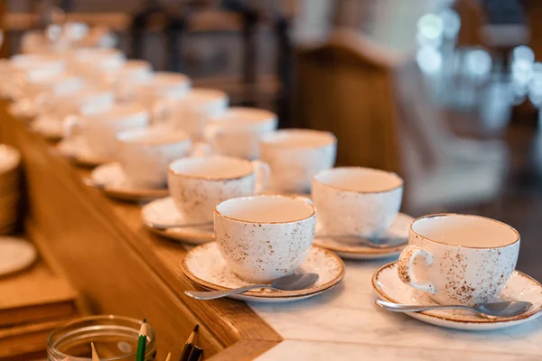 Group of empty cups in many rows of a white cup for coffee in breakfast and seminar event. designed in vintage retro style. — Stock Photo, Image