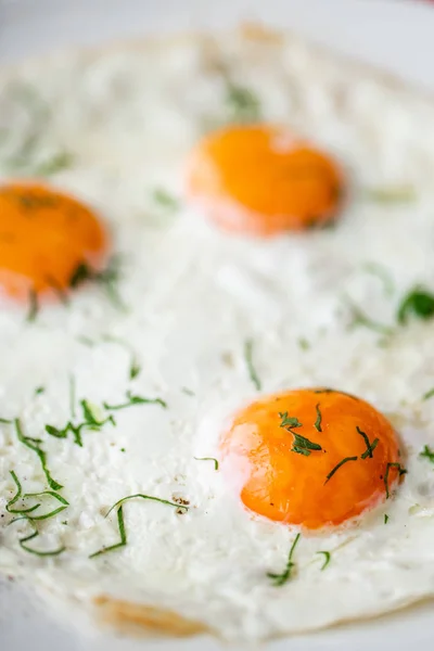 Fried egg. Close up view of the fried egg on a white plate. Light morning Breakfast, fresh warm pastries and aromatic cappuccino coffee — Stock Photo, Image