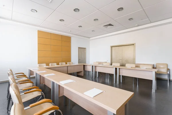 Empty modern conference hall in new hotel. Room for training, education, group classes, exams. Audience for Speakers at Business convention and Presentation.