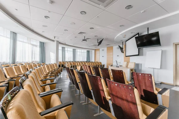 Big empty modern conference hall in luxury hotel. Audience for Speakers at Business convention and Presentation. Photo for illustration meeting, seminar, conference