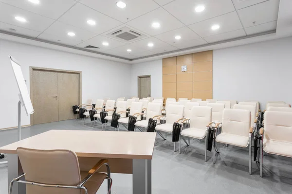 Empty modern conference hall in new hotel. Room for training, education, group classes, exams. Audience for Speakers at Business convention and Presentation.