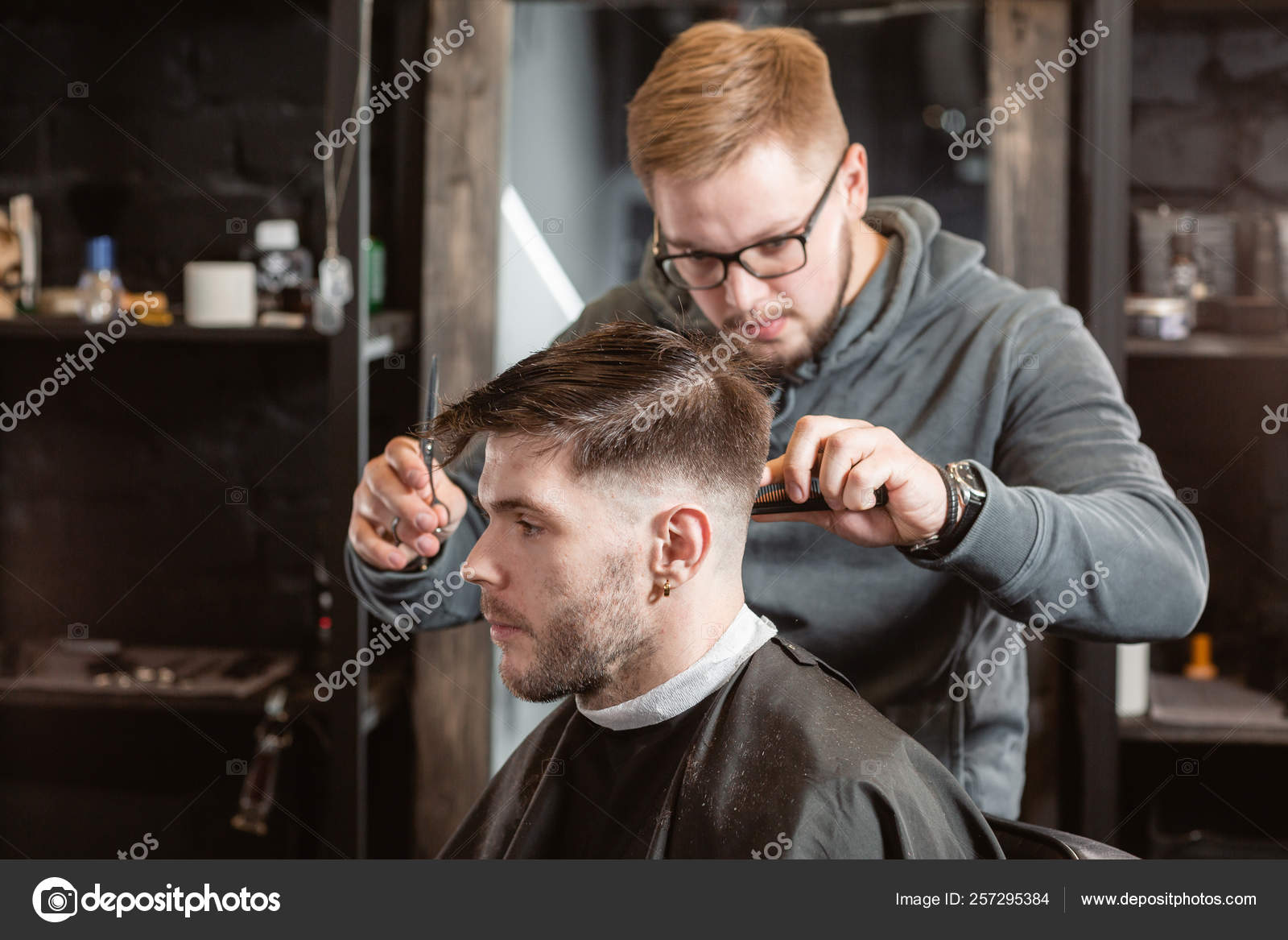 Hair cutting with metal scissors. Master cuts hair and beard of men in the barbershop, hairdresser makes hairstyle for a young man Stock Photo by ©MalkovKosta 257295384 Hair cutting with metal scissors. Master cuts hair and beard of men in the barbershop, hairdresser makes hairstyle for a young man Stock Photo by ©MalkovKosta 257295384