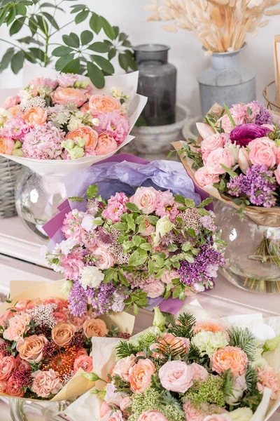 showcase flower shop. Beautiful spring bouquets. Arrangement with mix flowers. Small family business. Work florist. copy space