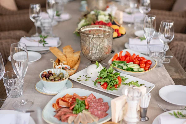 Gala dinner, serving table for birthday or wedding. Different meals for the guests on Banquet. delicious dishes on the table in the restaurant.