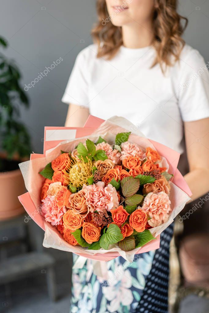 Bouquet Peach and orange color. beautiful hydrangea flowers in a vase on a table . Decoration of home. Wallpaper and background.