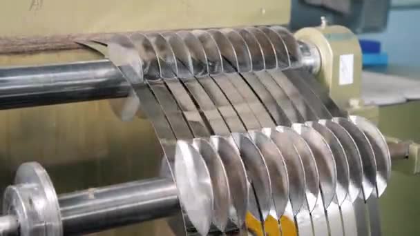 Sheet metal cutting machine for the production of steel pipes. Packed rolls of steel sheet, Cold rolled steel coils — Stock Video