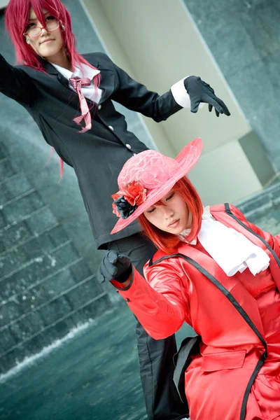 Bangkok, Tayland - 30 Ağustos 2008: Siam Pagagon, Bangkok önünde bir cosplay Festivali sırasında fotoğrafçısına poz genç güzel Thais kızlar