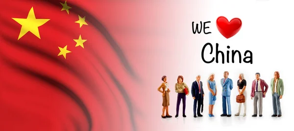 we love China, A group of people pose next to the Chinese flag.